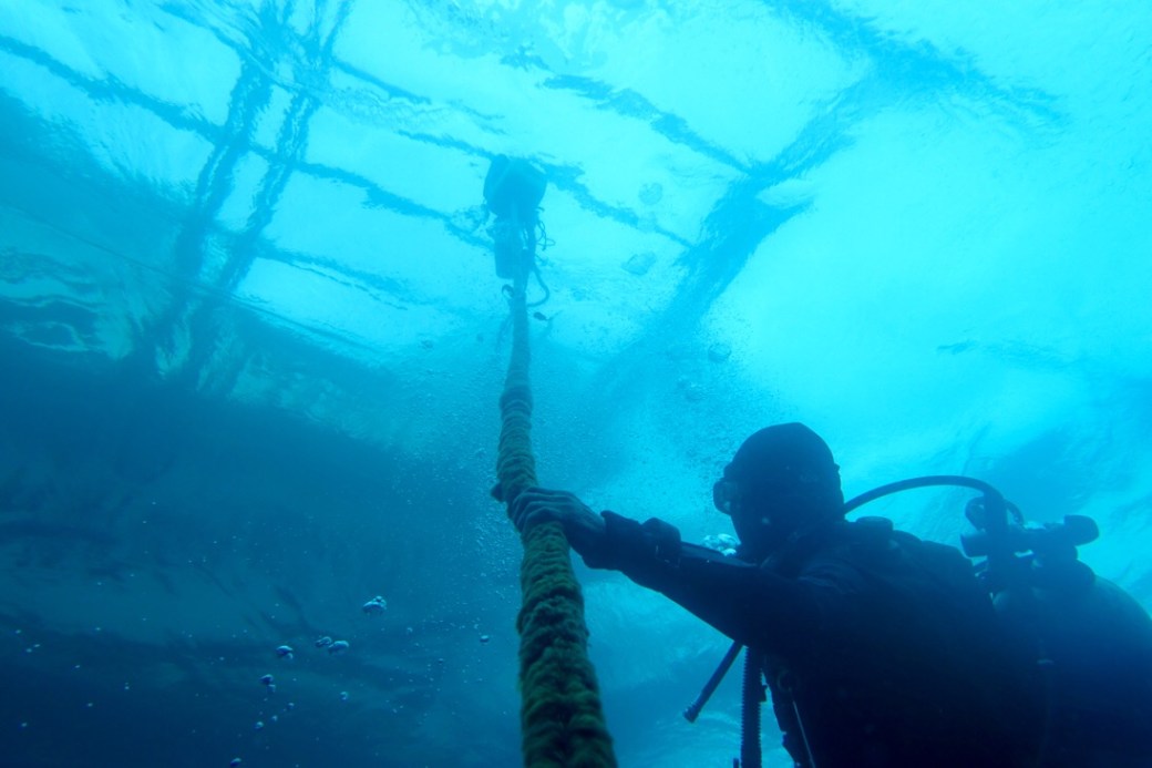 Pusoy, gassing off under the dive boat.